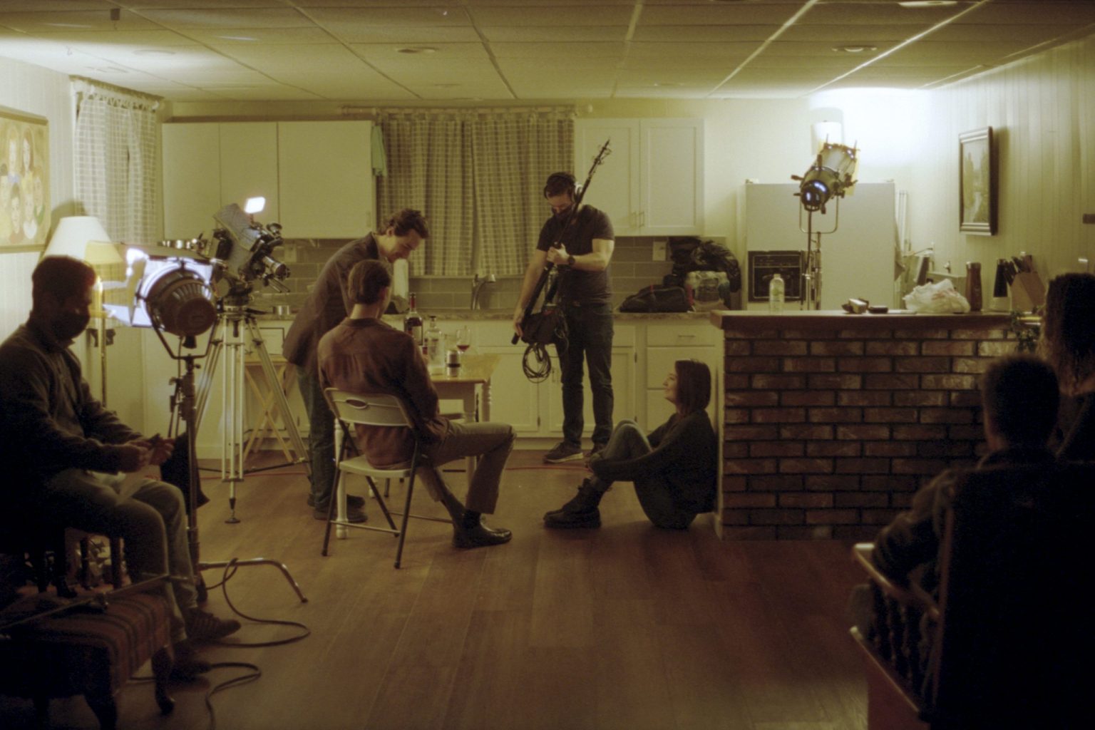 A wide image of the cast and crew working on the set of A Moment Is Enough.